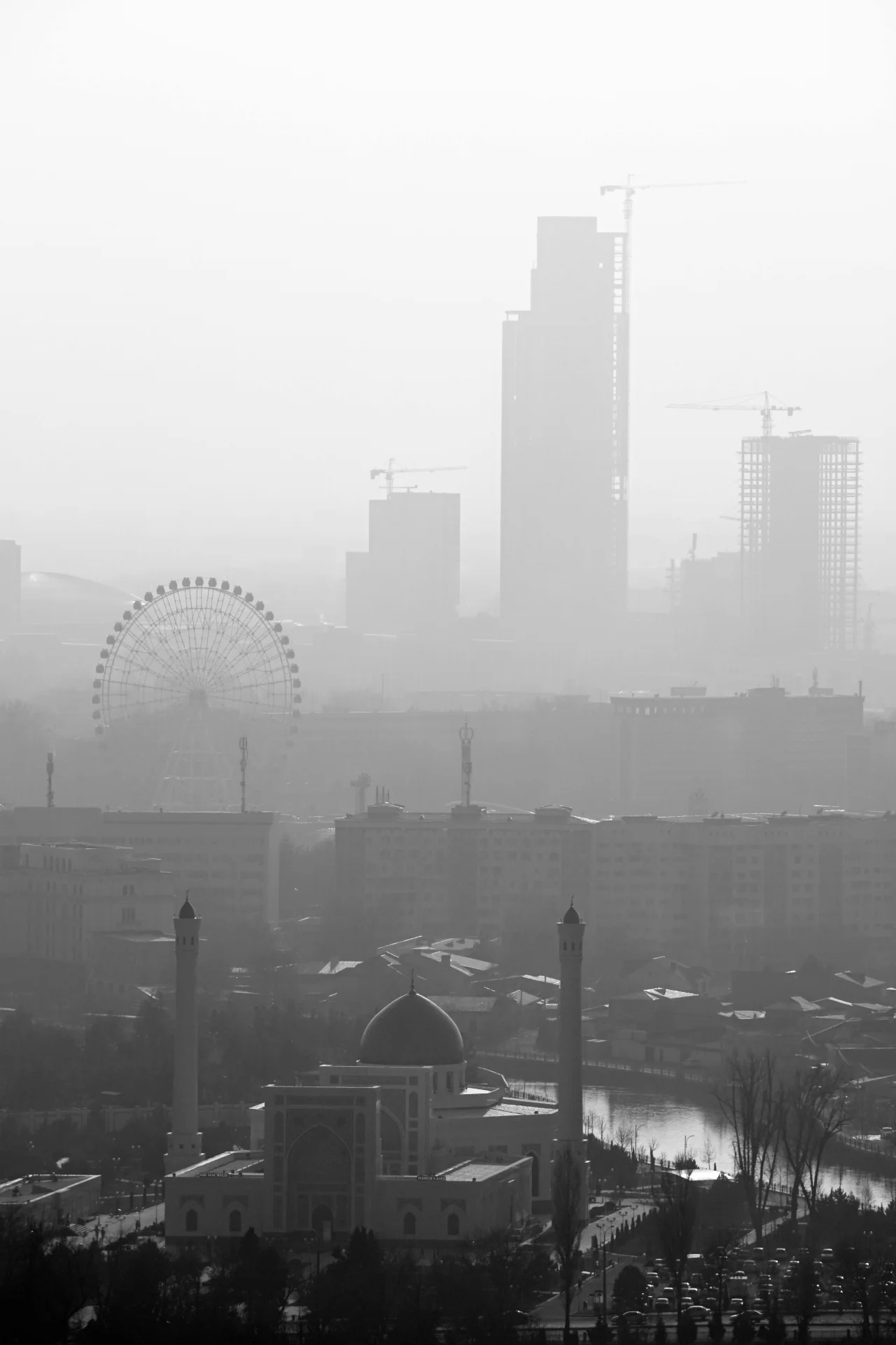 Grayscale skyline fading into haze, expressing reduced signal clarity, suspended visibility, and urban uncertainty.