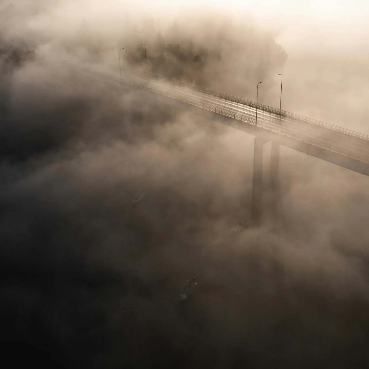Bridge partially covered in fog, representing uncertain transition and hidden coupling risk.