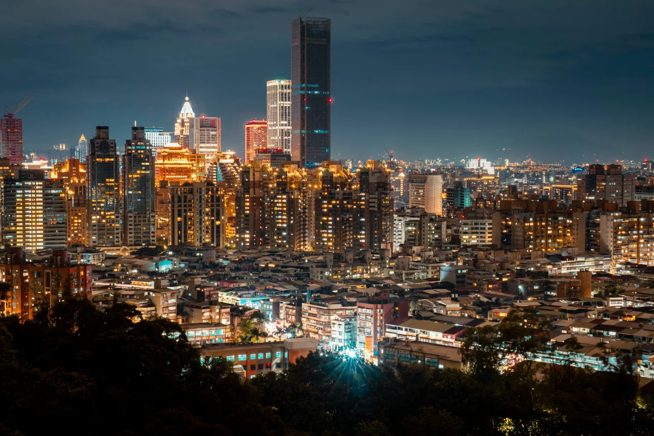 Dense city skyline at night with layered lights, suggesting active systems, signal concentration, and urban decision complexity.